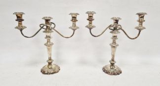 Pair of silver-plated three-branch candelabra, each 35cm high approx. (2)