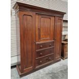 Victorian mahogany compactum with cavetto cornice, central cupboard with framed arch panel door,