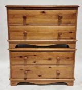 Pair of pine two-drawer chests with bun handles, on bracket feet, each 55cm high x 91cm wide x