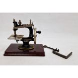 Early 20th century child's mini sewing machine, no.20, 18cm high with original box