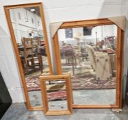 Modern pine rectangular wall mirror, 107cm x 74.5cm and two other smaller wall mirrors (3)