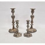 Pair of silver-plated candlesticks, relief decorated with birds amongst branches, 29cm high and a