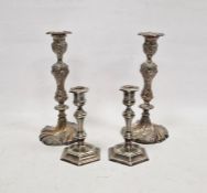 Pair of silver-plated candlesticks, relief decorated with birds amongst branches, 29cm high and a