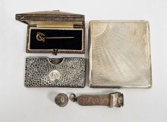 Silver cigar cutter, a silver square engraved cigarette case, 4ozt, a gold-coloured horseshoe hat