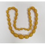 String of butterscotch yellow graduated amber beads, 70cm long approx.