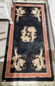 Modern Chinese black ground runner with central medallion featuring two dragons holding a ball