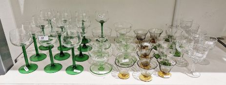 Set of French green stemmed hock glasses (13), set of six dessert bowls with green bases, and