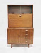 Mid 20th century Herbert Gibb sideboard having top shelf with two glass sliding doors, fall front to