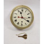 Brass cased bulkhead ships clock by Elliott Ltd of London, the circular dial with Roman numerals