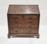 19th century oak bureau with fall front enclosing pigeonholes, drawers and cupboards above two short