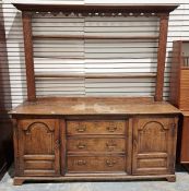 Antique oak dresser, the open plate rack with dentil and shaped cornice, fluted uprights, the base