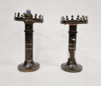 Two bronze-effect and gilt Arts & Crafts-style candlesticks (weighted) (2)