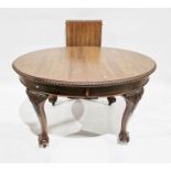 Mahogany wind-out dining table, oval with gadrooned border, having large acanthus carved tapering