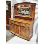 Arts and Crafts oak dresser of Scottish style with mirrored superstructure flanked by ionic