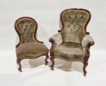 Victorian mahogany button back armchair with grey upholstery, on cabriole supports and castors and a