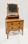 Early 20th century lightwood dressing chest of two drawers, with swing frame mirror, on shaped