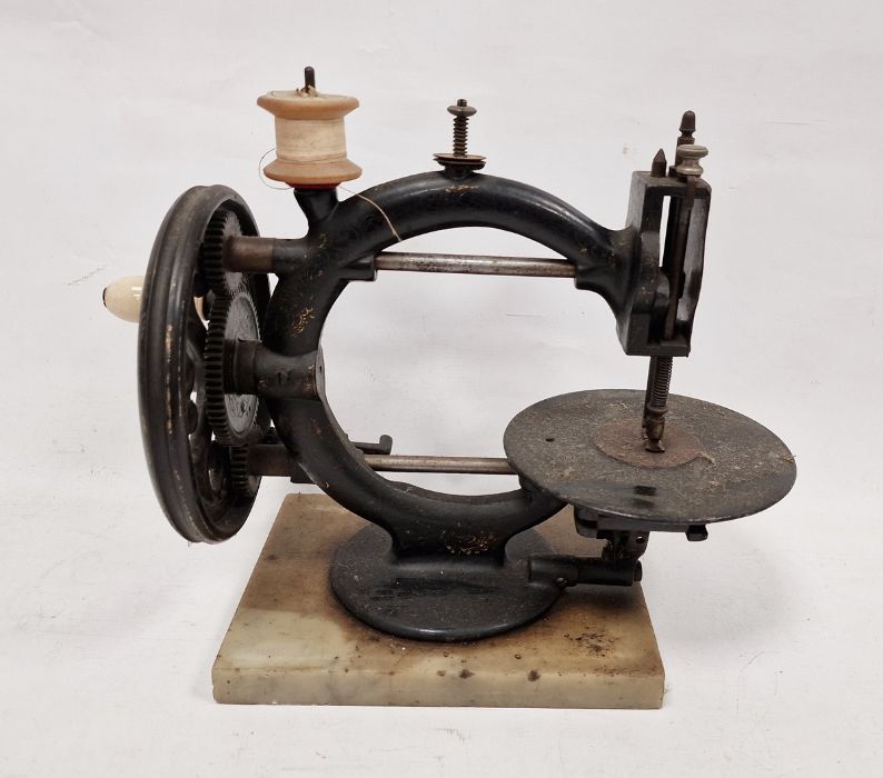 Late 19th century 'Wanzer, Time Utilizer' sewing machine, no.136379, on marble base, 24cm high