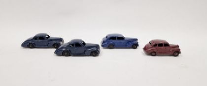 Four Dinky playworn diecast model cars to include 2 X  39f Studebaker - dark blue body, black