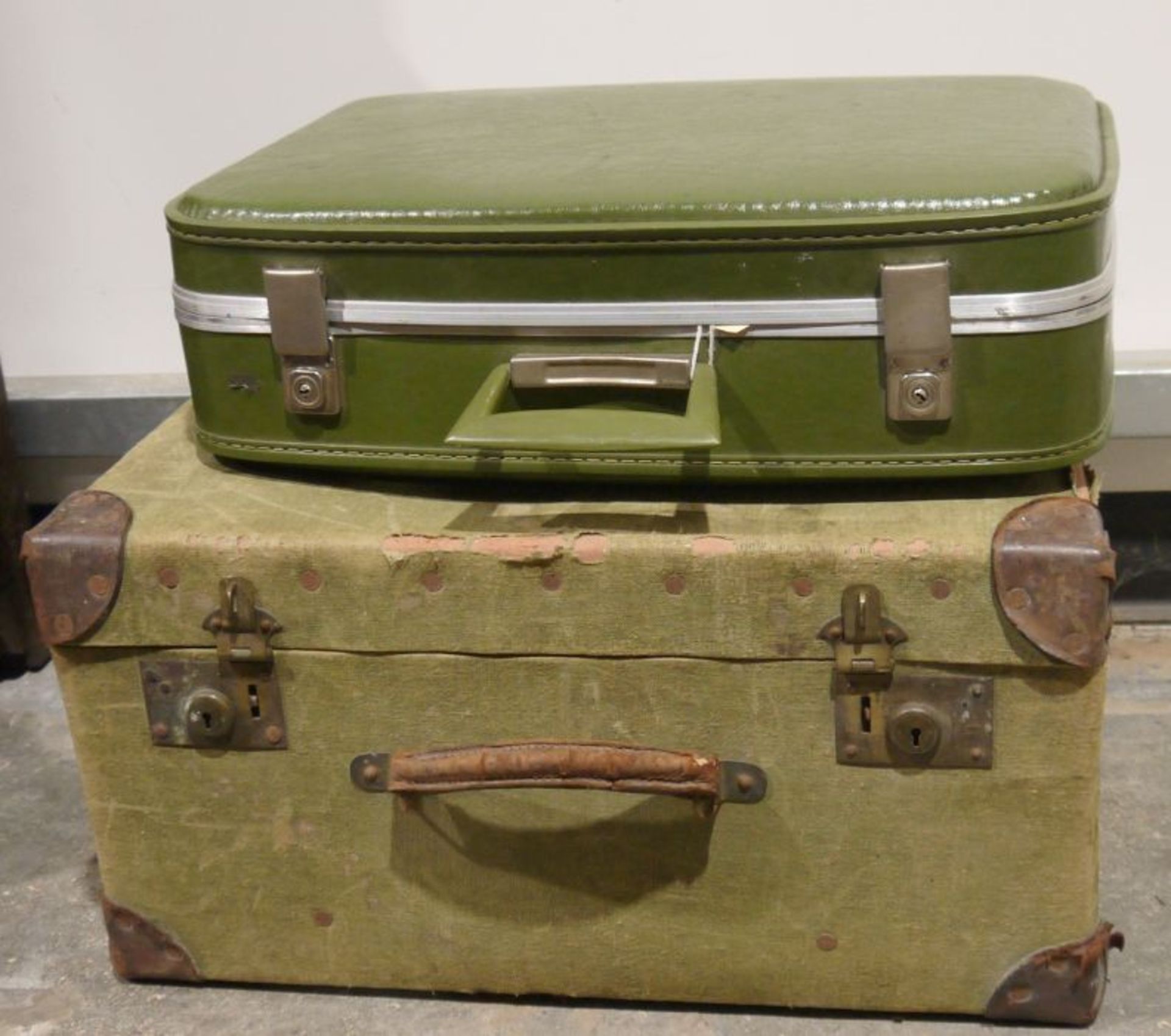 Vintage canvas and leather-bound suitcase and a further vintage leather suitcase (2)