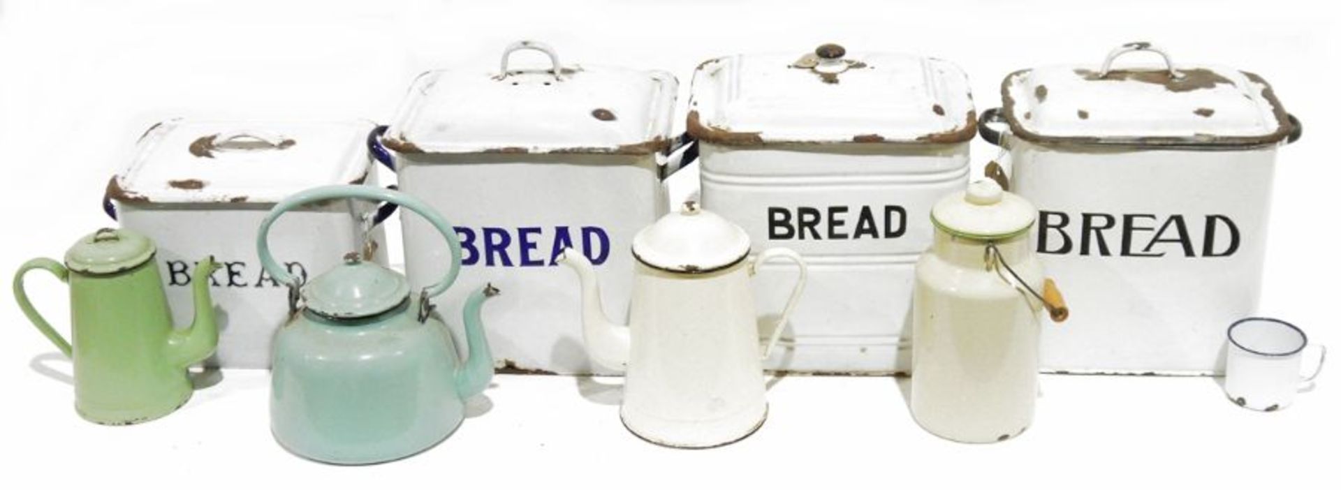Four enamelled metal bread bins, an enamelled metal milk pail/churn and a teapot (6) Condition