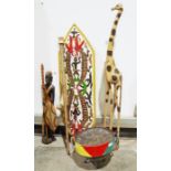African carved model of a giraffe, a steelpan drum, a pair of women's Geta shoes, a wooden shield