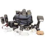 Quantity of vintage cameras and lenses to include examples by Sigma, Tamron, Kodak Brownie 127,