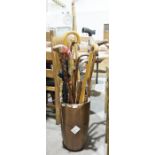 Collection of walking sticks and other items  in ceramic stick stand