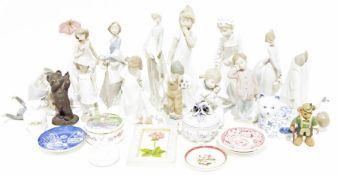 Quantity of figurines to include Lladro and Nao, a glass vase with cut floral decoration and further