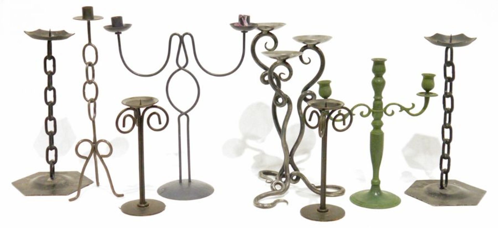 Pair of metal candlesticks with welded chain link stems and further metal candlesticks and