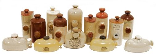 Quantity of stoneware foot warmers to include examples by Mence Smith, J. & W. Baker Dunstable,