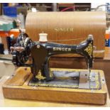 Vintage Singer sewing machine housed in wooden case Condition ReportThe case does have a key -