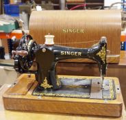 Vintage Singer sewing machine housed in wooden case Condition ReportThe case does have a key -