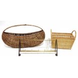 Two vintage atomic-style magazine racks, a vintage wooden Haxyes magazine rack, a wicker basket, a