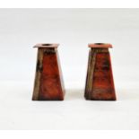 Pair of late 20th century copper, enamel and wooden-mounted candlestick holders, in orange, 11cm