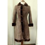 A vintage sheepskin coat with frog fastening and fur collar cuffs and hemCondition ReportFew small