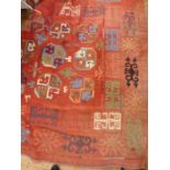 Heavy cotton kilim-style hanging, the red ground with octagonal quartered elephant foot guls, in