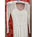 A 1960's cream lace wedding dress, ballerina length with white sequin detail, side zip, an early