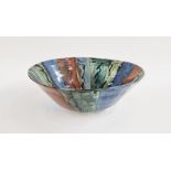 Large white stoneware bowl with red, blue and green glaze panels, incised LW mark to base, height