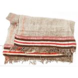 Brown, pink and cream woven wool tasselled rug, two panels stitched together, with striped border,
