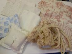 Large cream cotton curtain rope tie backs with full deep tassels, toile de jouy quilted cushion