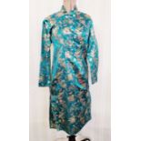 A vintage c.1950s cheongsam, machine embroidery on a turquoise ground, modern size 10