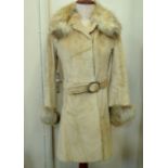 A vintage Fendi fur coat made in Italy, the lining with various zipped pockets, internal waist