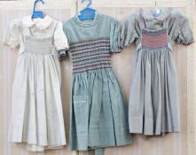 Various hand smocked children's dresses and pinafores, made in the late 1970's by Daisy Chain (