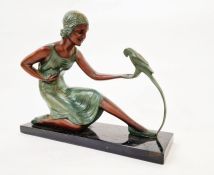 Art Deco painted plaster figure of a lady with parrot, on faux marble rectangular base, 30cm high