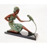 Art Deco painted plaster figure of a lady with parrot, on faux marble rectangular base, 30cm high