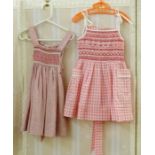 Various hand smocked pinafores and dresses by Daisy Chain, ages 2 and 3, Liberty print and other