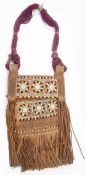 African embroidered leather and tasselled bag with purple stranded handle, the bag panels with