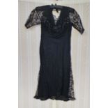 A 1920's/30's black crepe dress, lace godets, lace sleeves, beaded bodice in faux jet, and a black