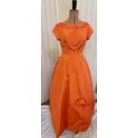 Various vintage 1950's and later dresses to include an orange ribbed satin ball gown stiff