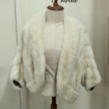 A white mink vintage evening cape with sleeves, labelled Fishers Furriers, approximate size 12-14